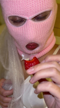 Girl in a Pink Balaclava Sensually Eats Strawberries
