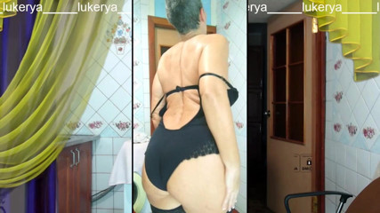 Lukerya: Okouzlující Lukerya středního věku se zahřívá s veselým úsměvem během vysílání...