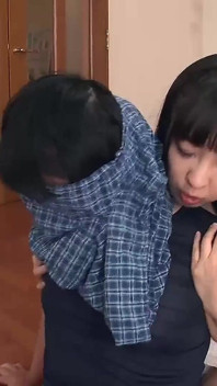 Whispering in His Ear From Behind and Giving Him a Hand Job While Pushing Her Big Tits Against His Back
