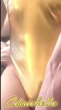 Cdmichelle Wearing Gold Bodysuit