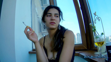 Fingering her pussy on the balcony while smoking