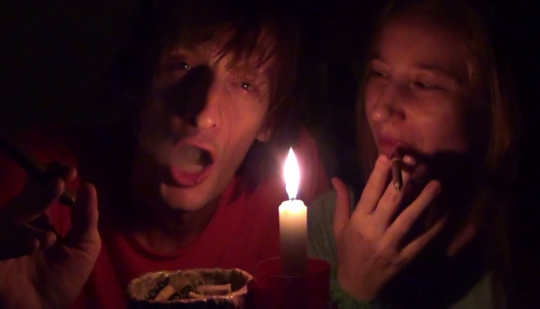 Sensual Lotuses: Couple Smoke Next to Candle