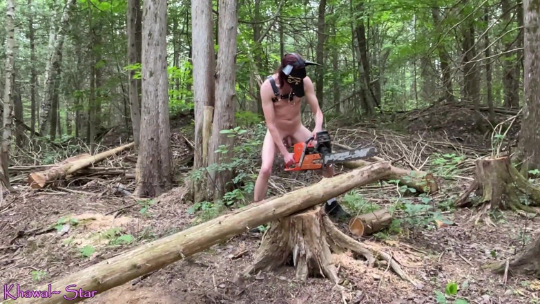 Khawal Star: Khawal Anubis naked outdoors using chainsaw