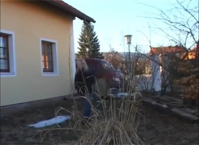 Femdom Austria: Slut pisses next to a house