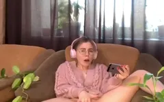 Watching Porn. the Lusty Gameress Decided to Satisfy Her Sweet Pussy with Fingering