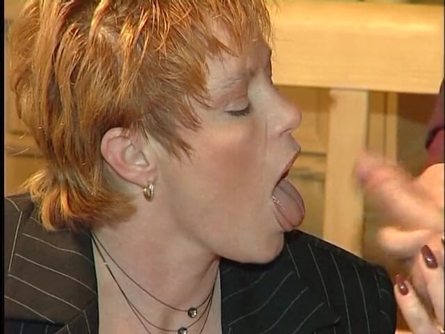 Xfucks: Glamorous redhead mature gives a blowjob in the kitchen