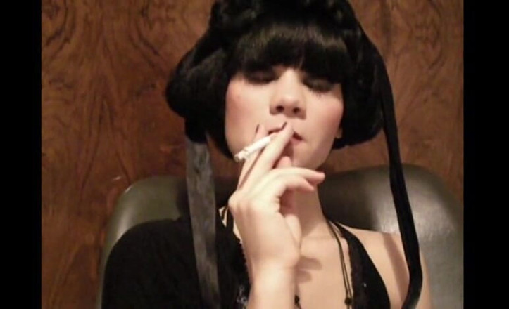 Femdom Austria: Glamorous beauty smoking a cigarette
