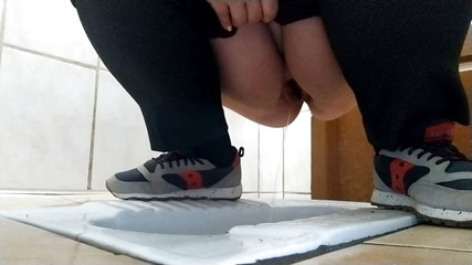 Thumbnail of Curvy milf pissing in a dirty public toilet.