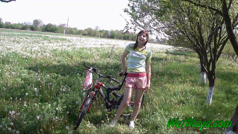 Wet Maya: Peeing on her bicycle