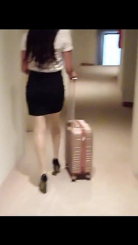 MILF in Stockings and Heels Walks Through the Corridors of a Hotel