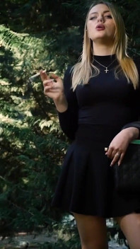 Hot Blonde Babe Smoking One Black Cigarettes in Nature