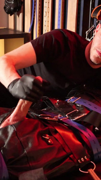 Edging the Boy in Leather Bondage but He Is Not Allowed to Orgasm