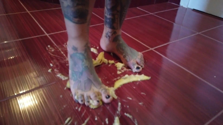 Fetish videos by Alex: A Banana Is Trampled by a Blonde Tattooed MILF