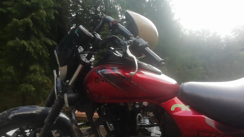 Abella Love: Red lips blonde smoking sensually on Rasta bike outdoor