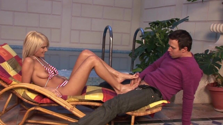 Fetish Desire: Amazing blonde gives a footjob to a man who has...