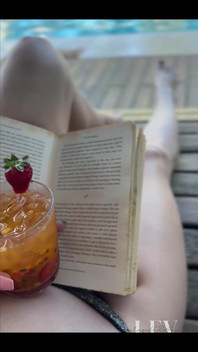 Reading by the Pool in a Bikini That Barely Counts as Spf