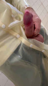Putting a Condom on in Transparent Latex Raincoat