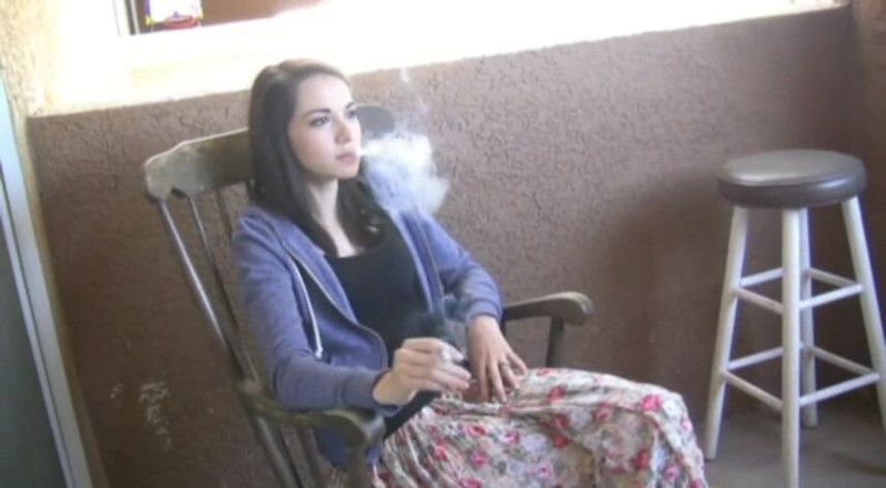 Femdom Austria: Cute brunette teen smoking a cigarette