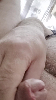 My Friend Sits in a Chair and Plays with His Little Cock and Watches Videos He Likes to Watch Videos Means He Watches Videos
