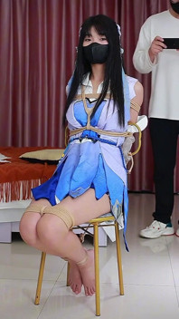 Cosplaying His Girlfriend Sitting Comfortably on a Chair with Ropes, Her Legs Hanging up