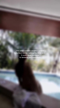 Woman Hijab Bathing Naked in an Open-air Hotel Pool
