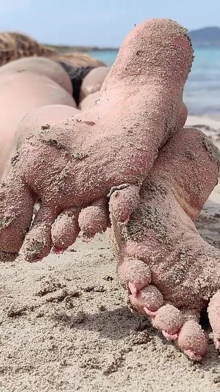 Goddess Lena: Covered in Sand and Above It All
