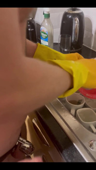 My Chastity Sub Washing the Pots for Me Naked in His Chastity Cage and with His Marigolds on