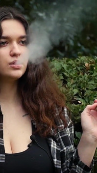 Sweet and Busty Russian Babe Smoking Cigarette in Nature