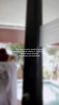Woman Hijab Bathing Naked in an Open-air Hotel Pool