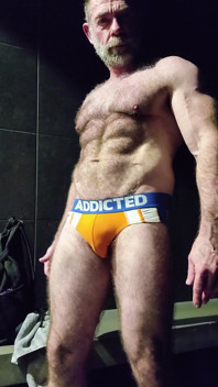 Muscle Bear Showing off His Uncut Cock