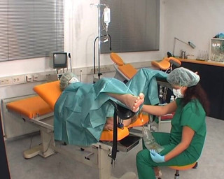 Rubber & Clinic Studio - 1ATOYS: Nurse in green surgery outfit
