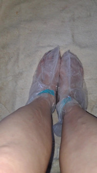 Pedicure Step Feet in Plastic Foot Mask Booties