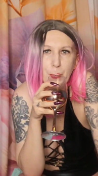 Lady Angela Femdom Goddess Spitting Into a Glas Then Pouring It Out