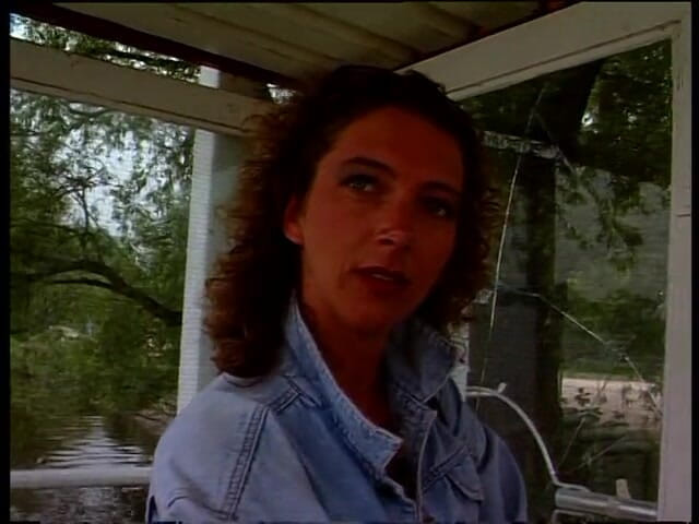 Lucky Cooch: Vintage brunette giving an interview outdoors