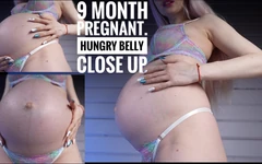 Le ventre d’une femme enceinte de 9 mois a faim. Taquinage et gros plan