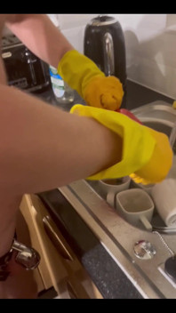 My Chastity Sub Washing the Pots for Me Naked in His Chastity Cage and with His Marigolds on