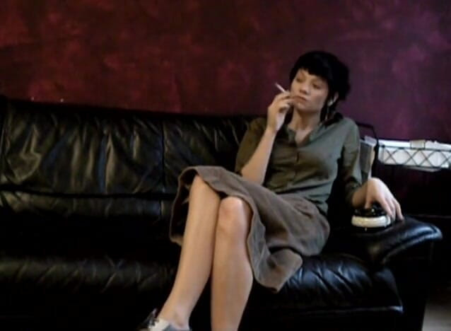 Femdom Austria: Black haired teen smoking a cigarette