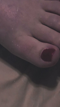 Sexy Red Toes in Bed