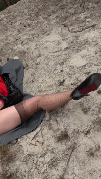 Hard self-fucking on a sandy dune