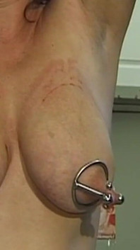 Redhead MILF Submits to Weighted Nipple Clamps