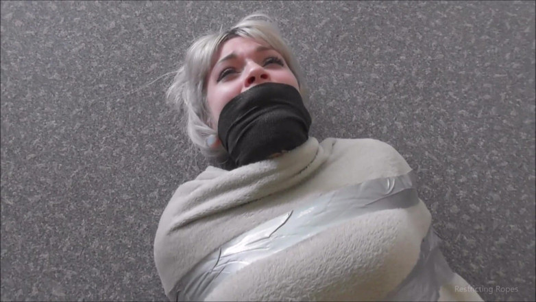 Restricting Ropes: Tied up by her captor on the floor
