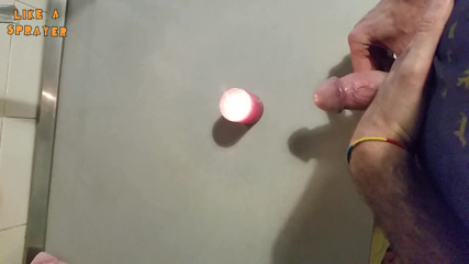 Like a sprayer: Candle cumshot by handjob