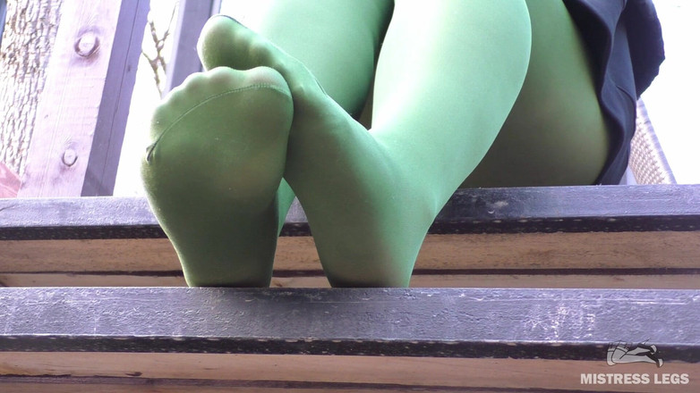 Mistress Legs: Goddess in Green Pantyhose Teases with Her Feet on the...