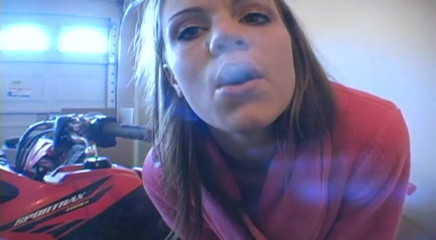 Femdom Austria: Lovely teen in bathrobe smoking a cigarette in garage