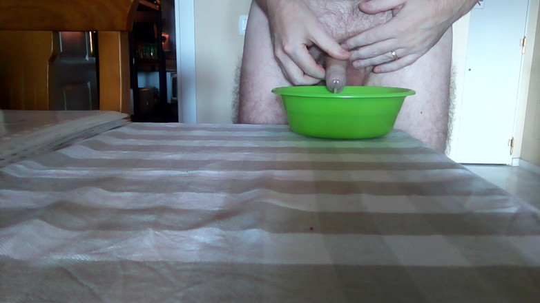 Sex hub male: John is peeing into a green bowl on the table