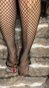 Fishnet in Open Toe Shoes with Red Nail Polish