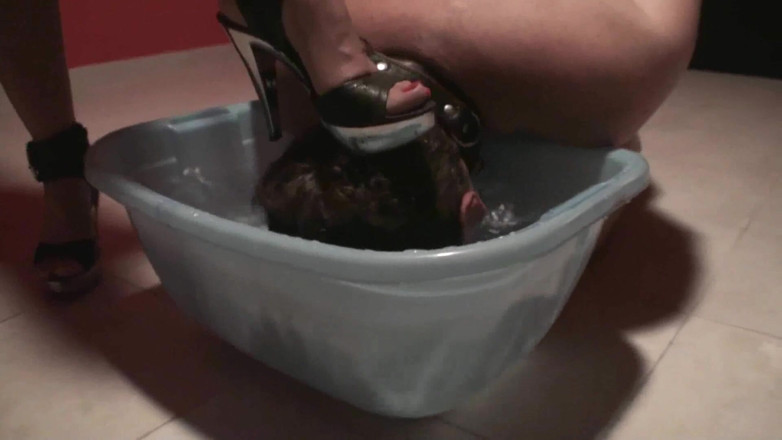 Femdom Austria: Stomping slave's head into the water