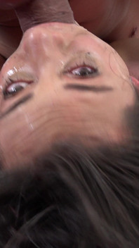 Brunette teen gags on a hard cock