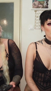 Tattooed ladies smoking in the kitchen