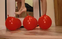 Heels crush balloons. Crushing heels